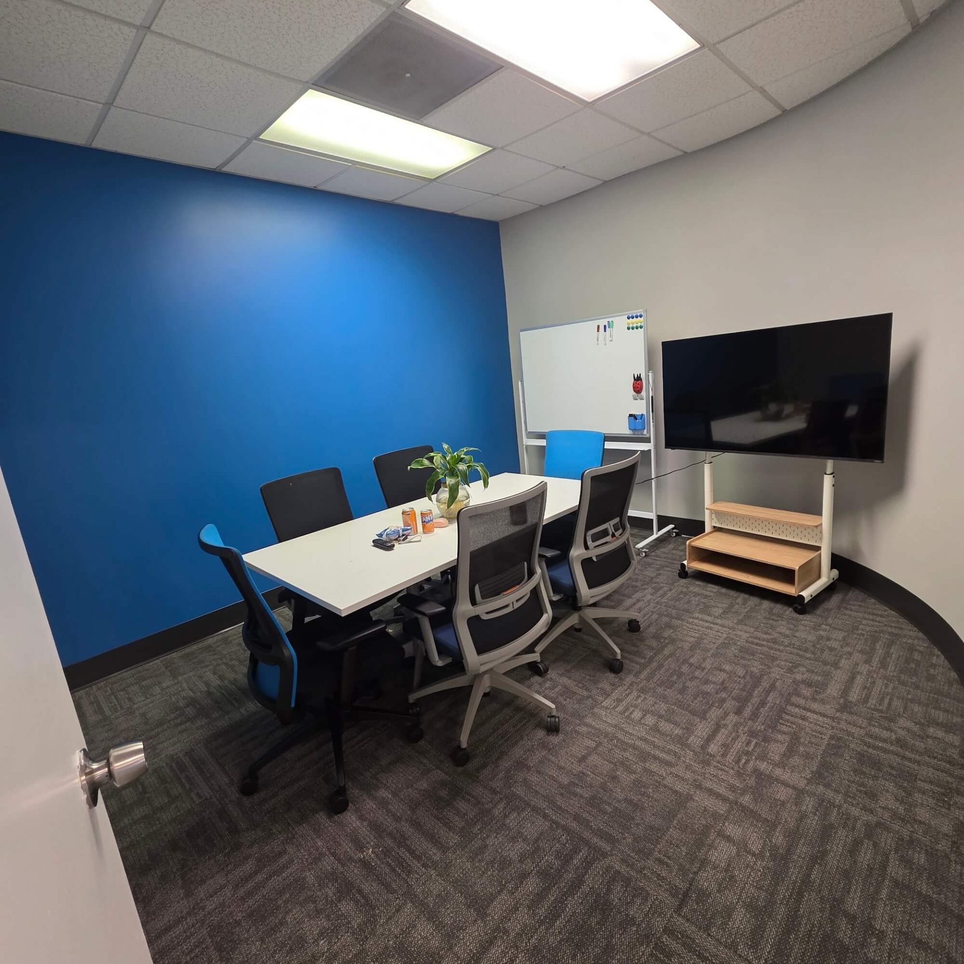 freshly repainted office interior with a bright blue accent wall