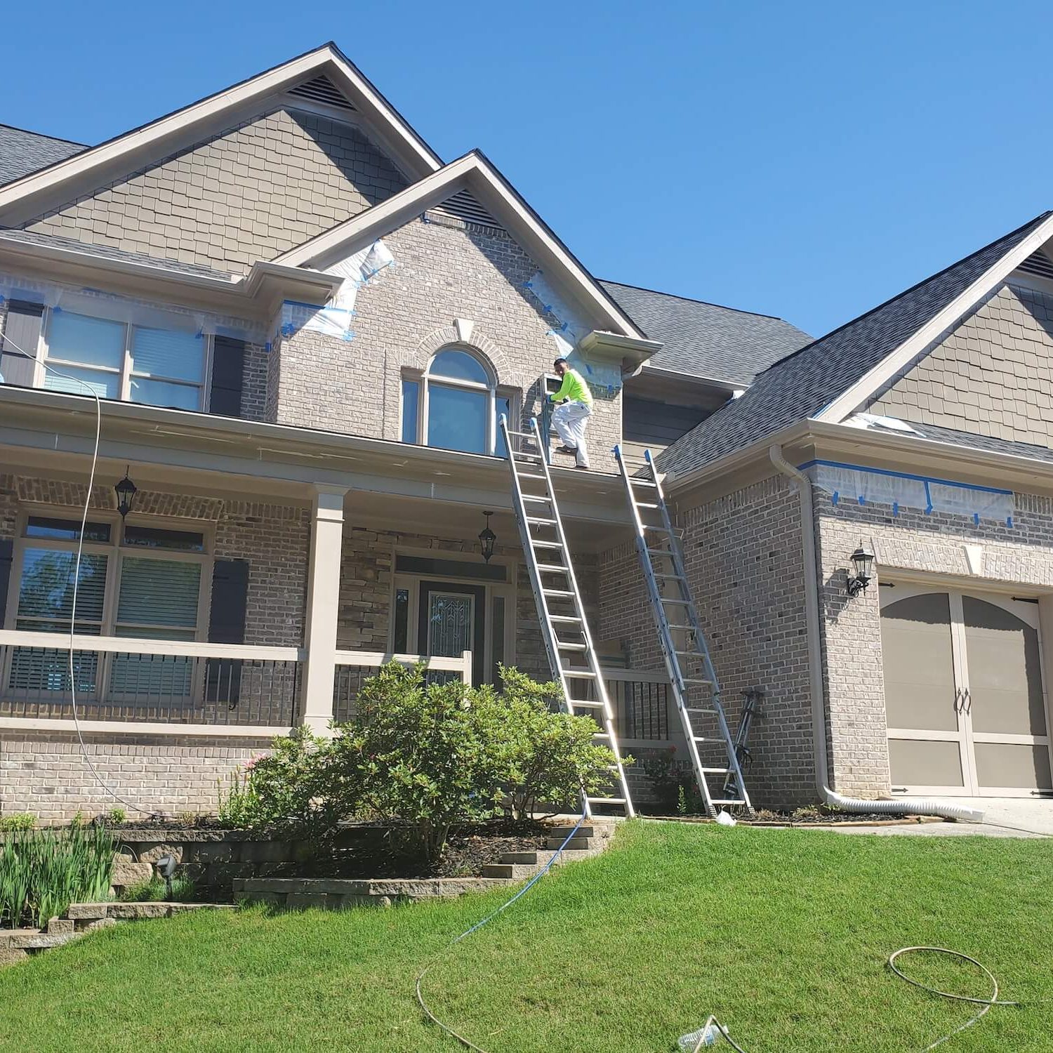 exterior painters prepping and painting lawrenceville home exterior